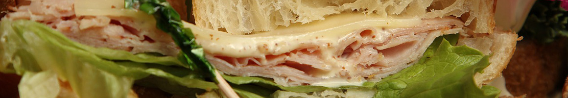 Eating Deli Sandwich at Romanelli's Italian Deli.